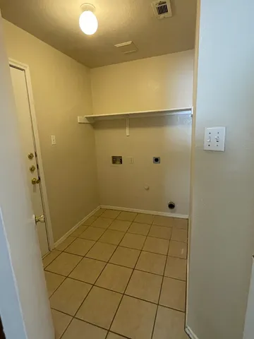 a kitchen that has a sink and a stove