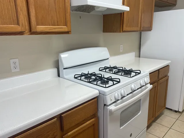 a bathroom with a shower a toilet and bathtub