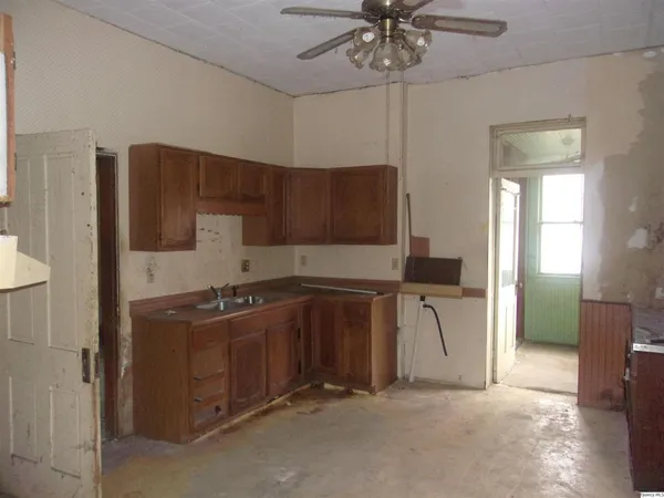a kitchen with stainless steel appliances granite countertop a stove and a refrigerator