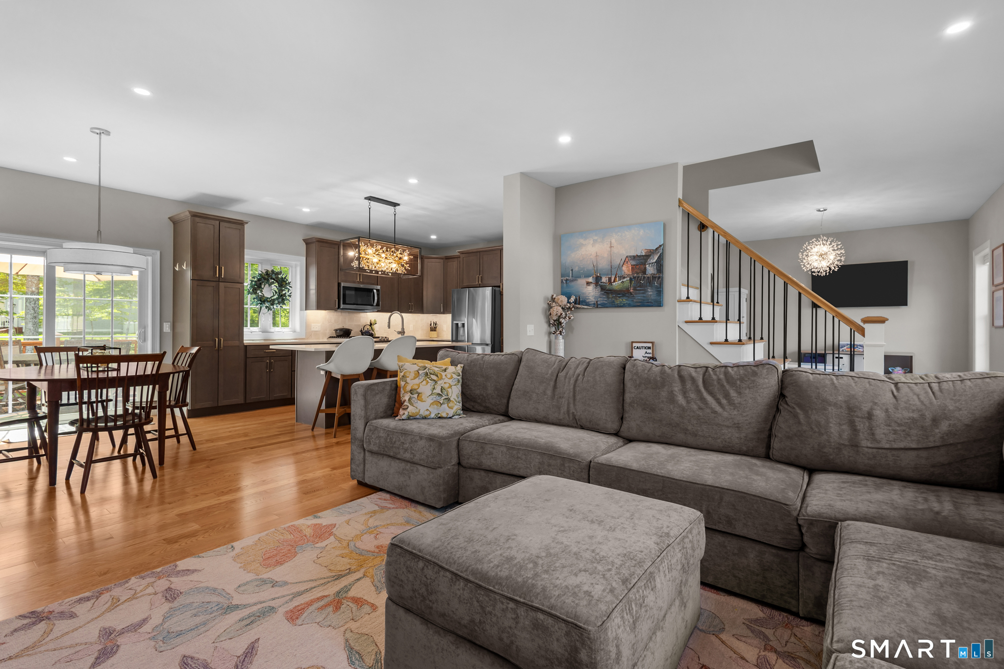 2 Martys Way Gales Ferry, CT 06335 - Photo 4 of 40 a living room with furniture and kitchen view