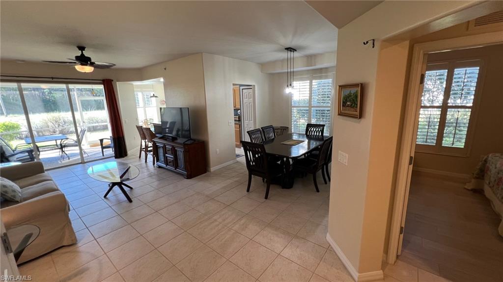 5705 Mayflower Way, Unit 1402 Ave Maria, FL 34142 - Photo 13 of 35 a living room with furniture and a large window