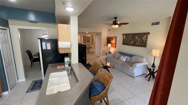 a view of a hallway with furniture and front door