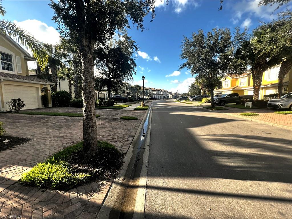 5705 Mayflower Way, Unit 1402 Ave Maria, FL 34142 - Photo 32 of 35 a view of a street with a building in the background