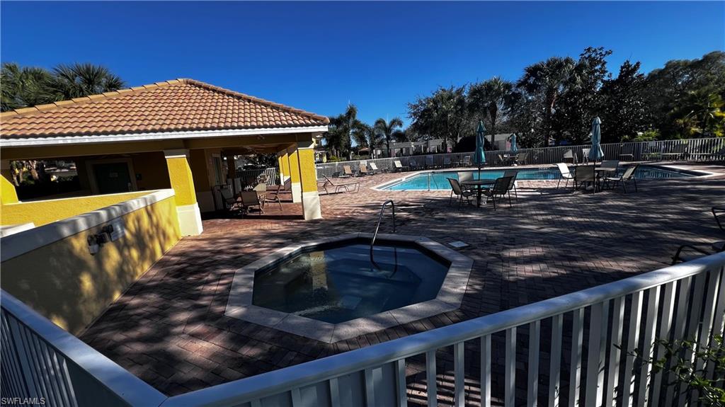5705 Mayflower Way, Unit 1402 Ave Maria, FL 34142 - Photo 33 of 35 a view of a house with backyard and sitting area