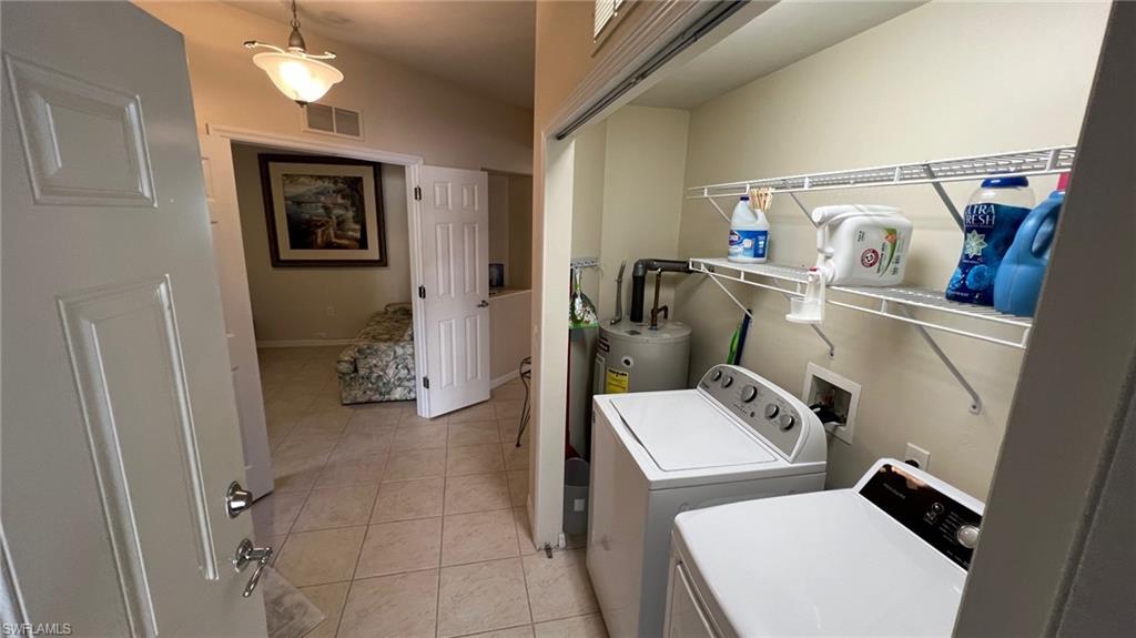 5705 Mayflower Way, Unit 1402 Ave Maria, FL 34142 - Photo 9 of 35 a utility room with dryer and washer