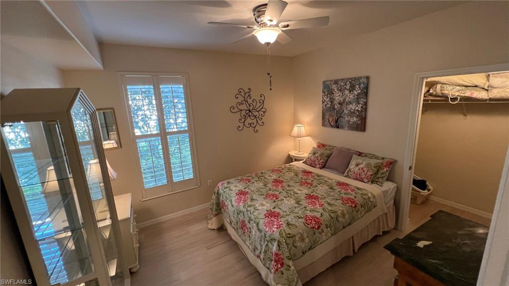 5705 Mayflower Way, Unit 1402 Ave Maria, FL 34142 - Photo 10 of 35 a bedroom with a bed and a window