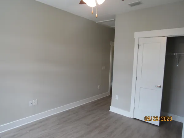 a view of a patio with table and chairs a barbeque with wooden fence