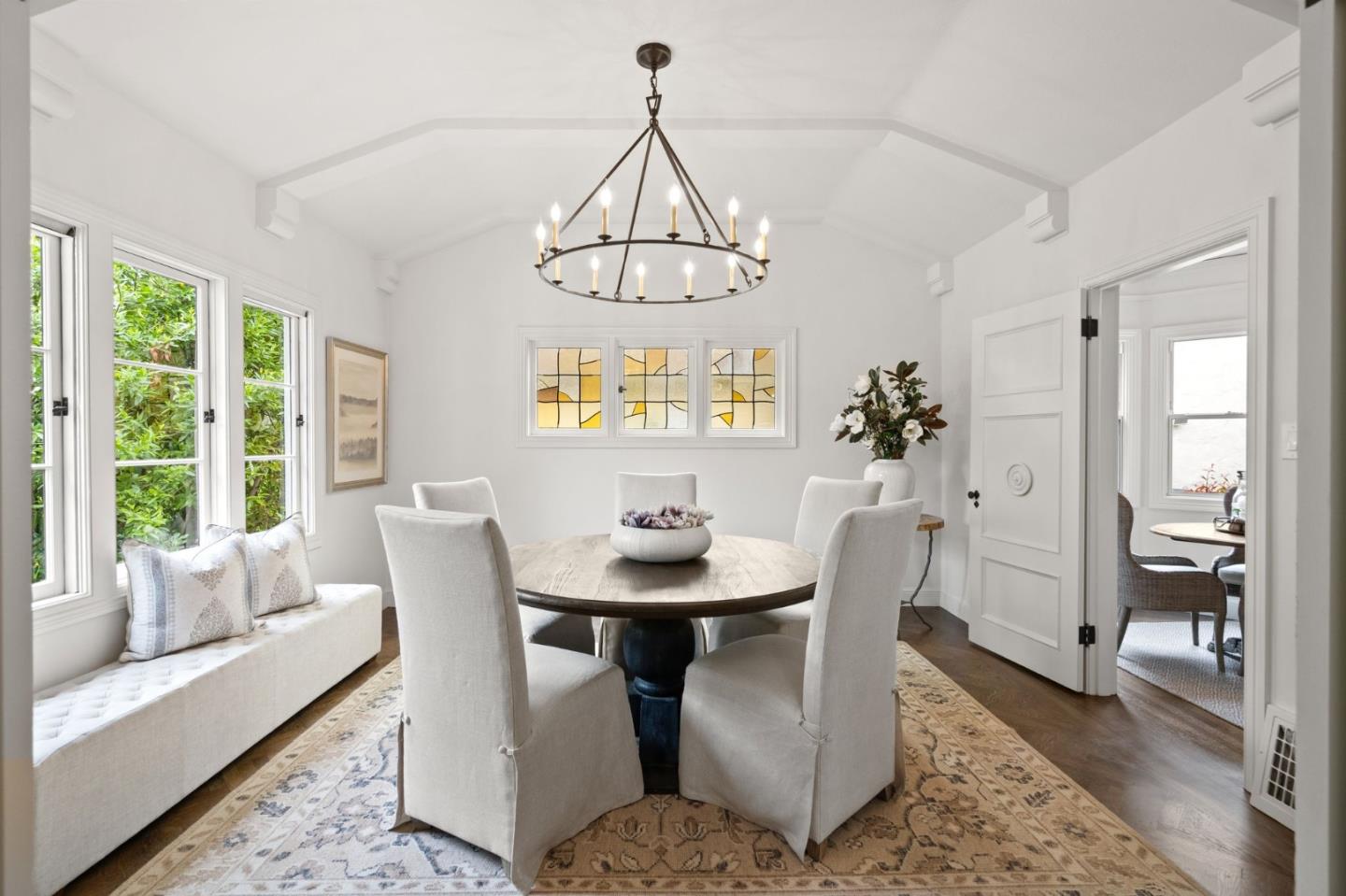 139 Warren Road San Mateo, CA 94401 - Photo 11 of 63 a dining room with furniture a chandelier and wooden floor