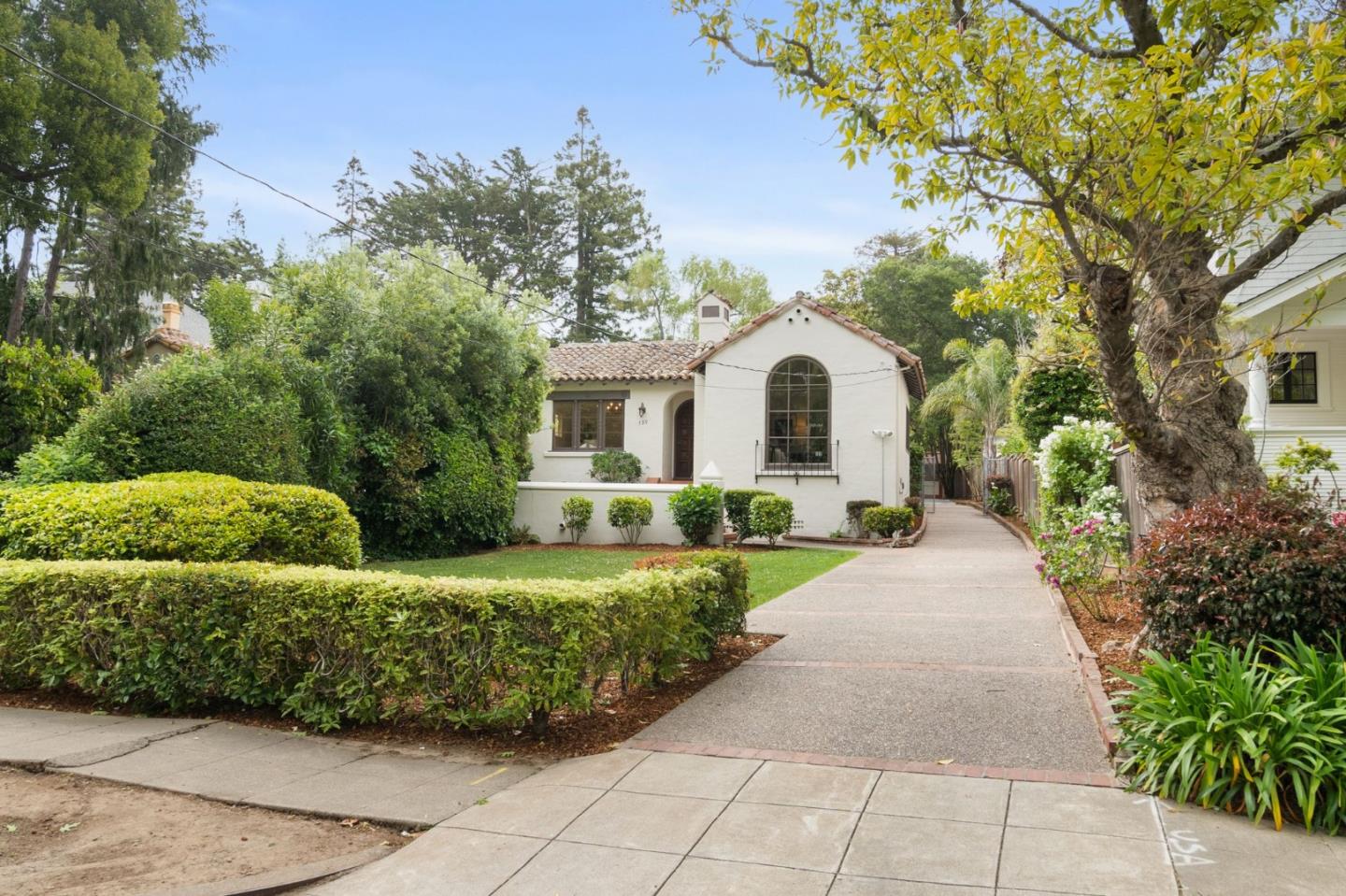 139 Warren Road San Mateo, CA 94401 - Photo 3 of 63 a front view of a house with a garden