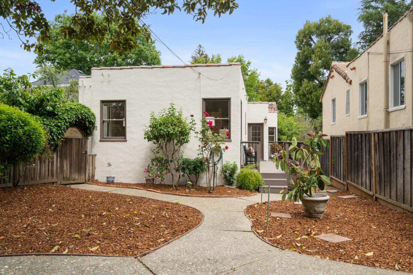 139 Warren Road San Mateo, CA 94401 - Photo 54 of 63 a front view of a house with a yard