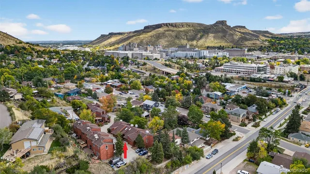 an aerial view of residential houses and outdoor space