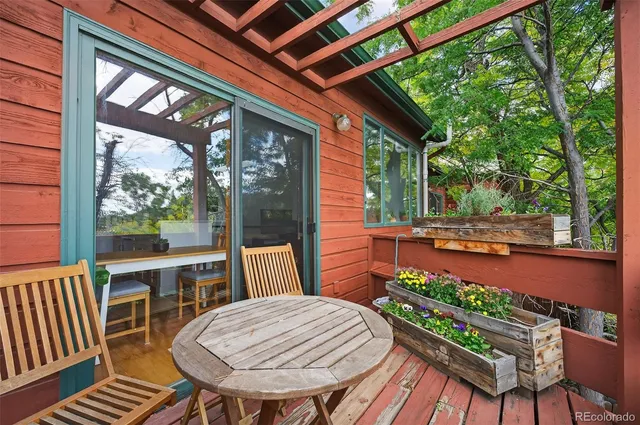 a view of a chair and table in the balcony