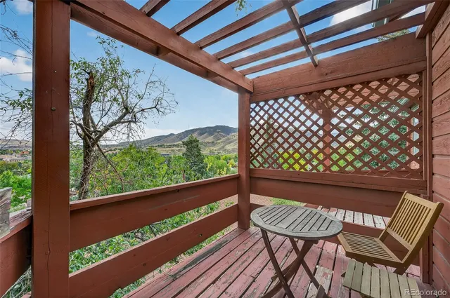 a view of a two chair in the patio next to a yard