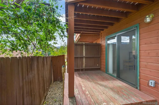 a couple of potted plants in front of a house