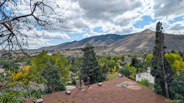 an aerial view of residential houses with outdoor space and swimming pool