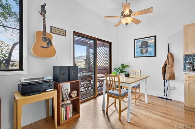 a view of a dining room with furniture window and wooden floor