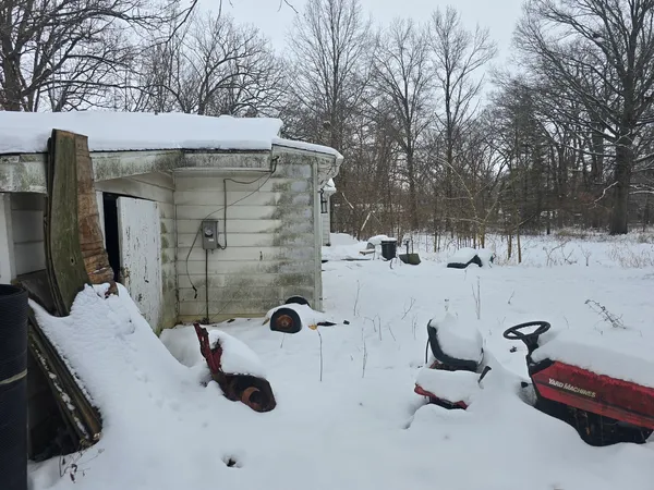 a view of backyard and snow