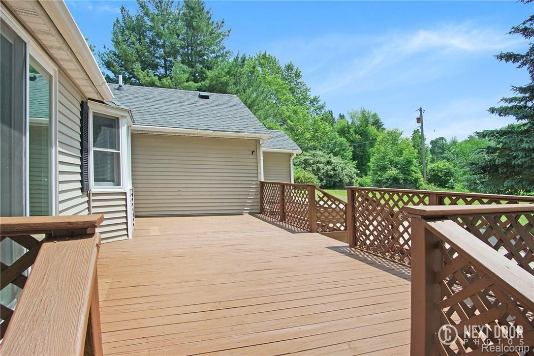 5789 Clarkston Road Clarkston, MI 48348 - Photo 32 of 37 FRESHLY STAINED DECK.jpg