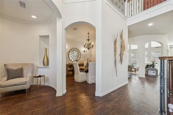 a view of a livingroom with furniture and hardwood floor