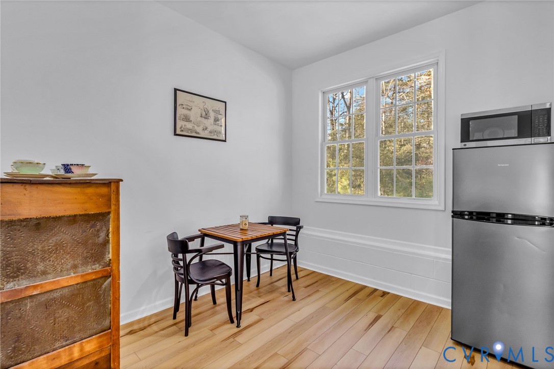 43 Ruddy Duck Road Heathsville, VA 22473 - Photo 31 of 46 a view of a dining room with furniture window and wooden floor