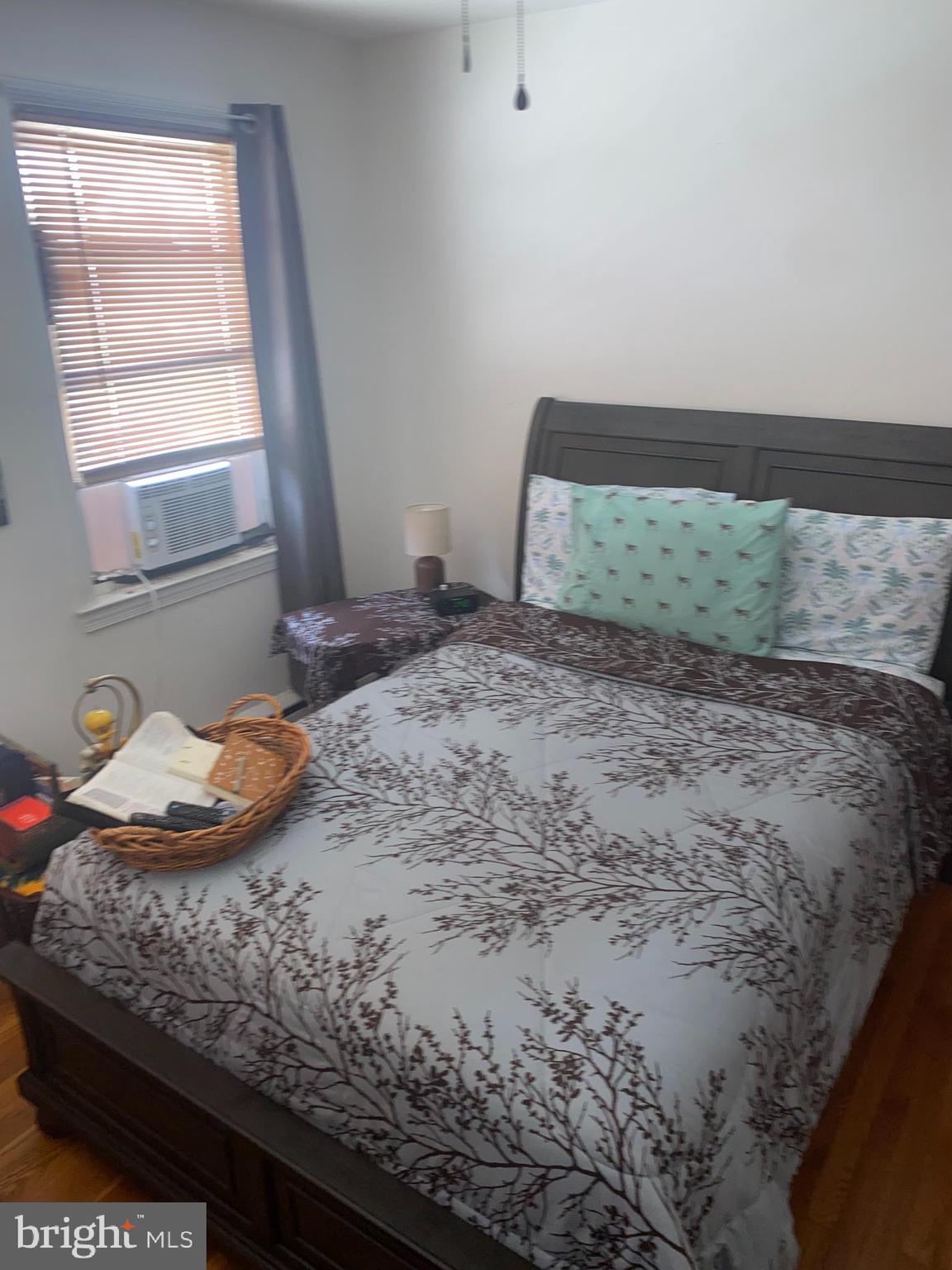 5905 Glenkirk Road Baltimore, MD 21239 - Photo 13 of 15 a bedroom with a bed and window