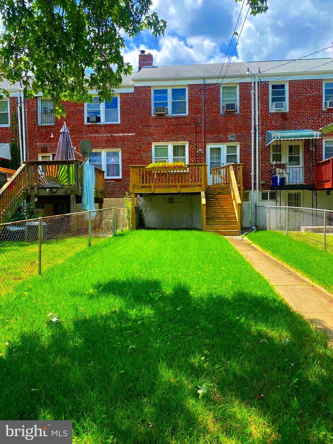 5905 Glenkirk Road Baltimore, MD 21239 - Photo 7 of 15 a view of a house with a backyard