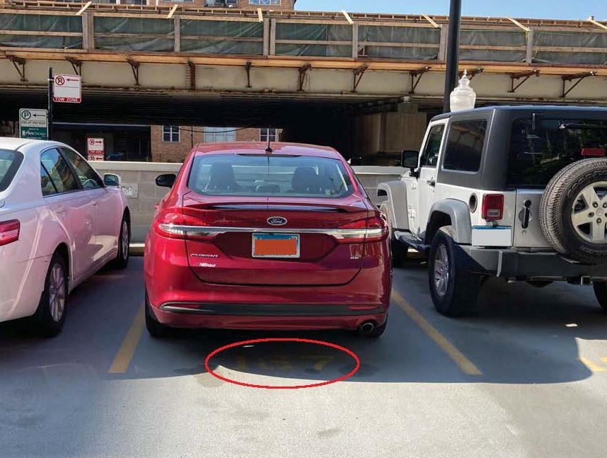 420 South Clinton Street, Unit 401A Chicago, IL 60607 - Photo 18 of 22 a car parked in a parking lot