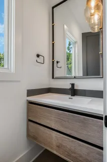 a bathroom with a sink and a mirror