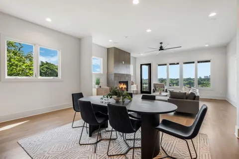 a view of a dining room with furniture and window