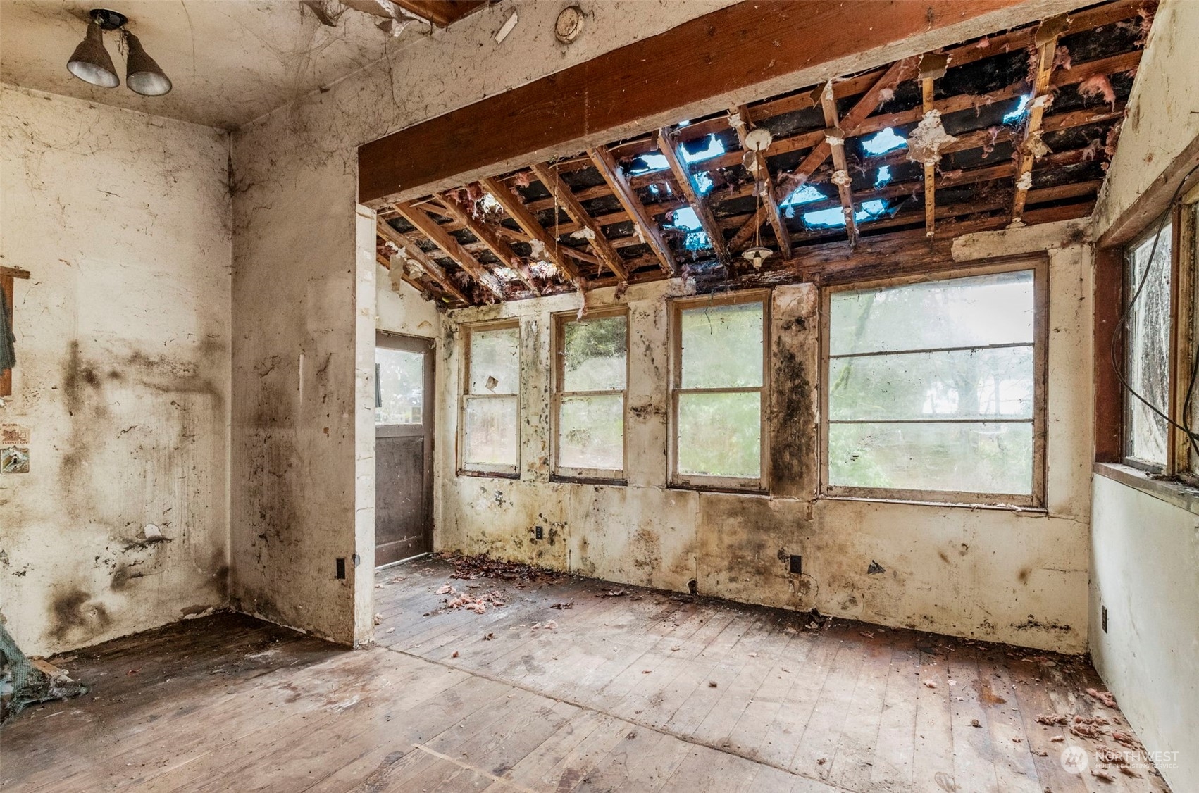 491 No Name Road Port Ludlow, WA 98365 - Photo 11 of 15 a view of a room with wooden walls and windows