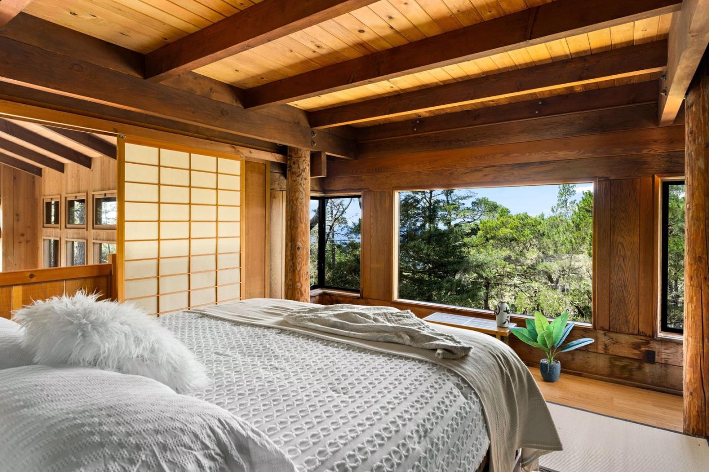73 Mt Devon Road Carmel Highlands, CA 93923 - Photo 36 of 88 a bed sitting in a bedroom next to a large window