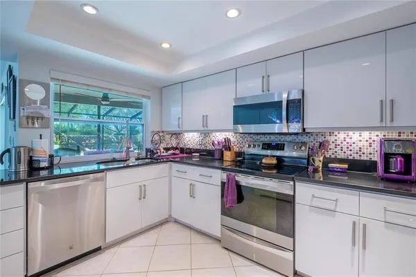 a bedroom with furniture a bed and a mirror