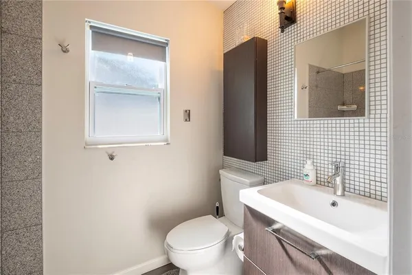 a patio with lawn chairs and glass door