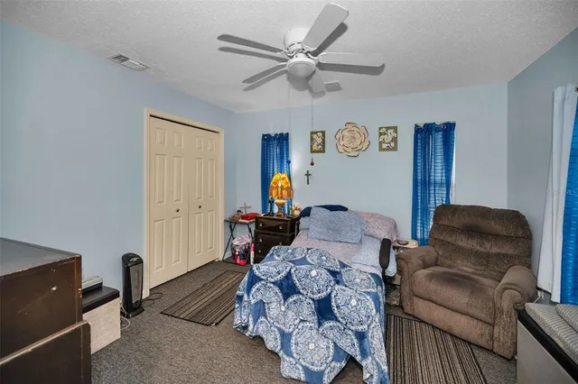 a bedroom with furniture and a window