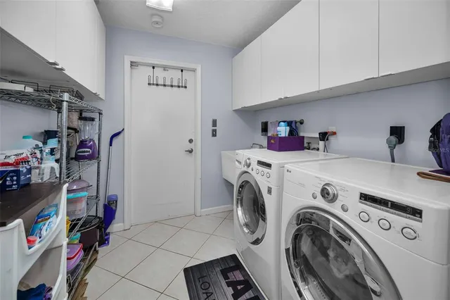 a view of storage and utility room with washer and dryer
