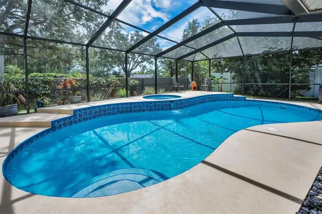 a swimming pool with yard outdoor seating and yard
