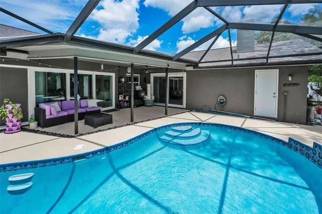 a view of a swimming pool with a patio