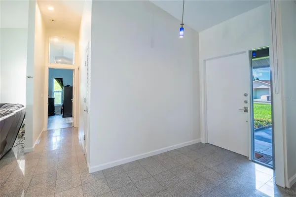 a bed room with a bed and a television