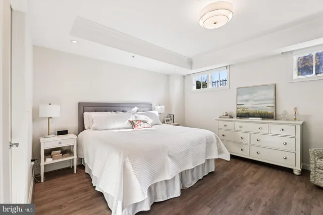 a bedroom with a bed and a dresser