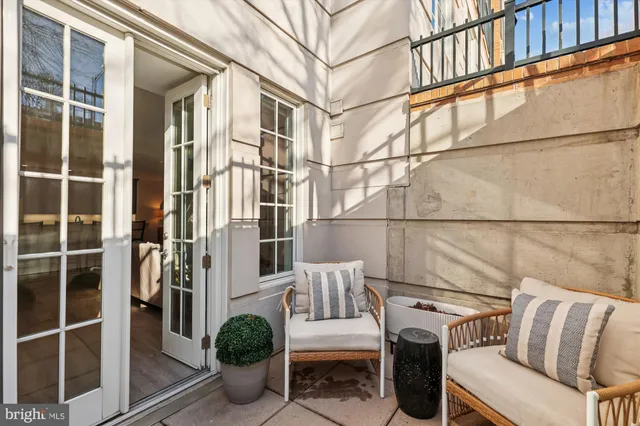 a view of a balcony with furniture
