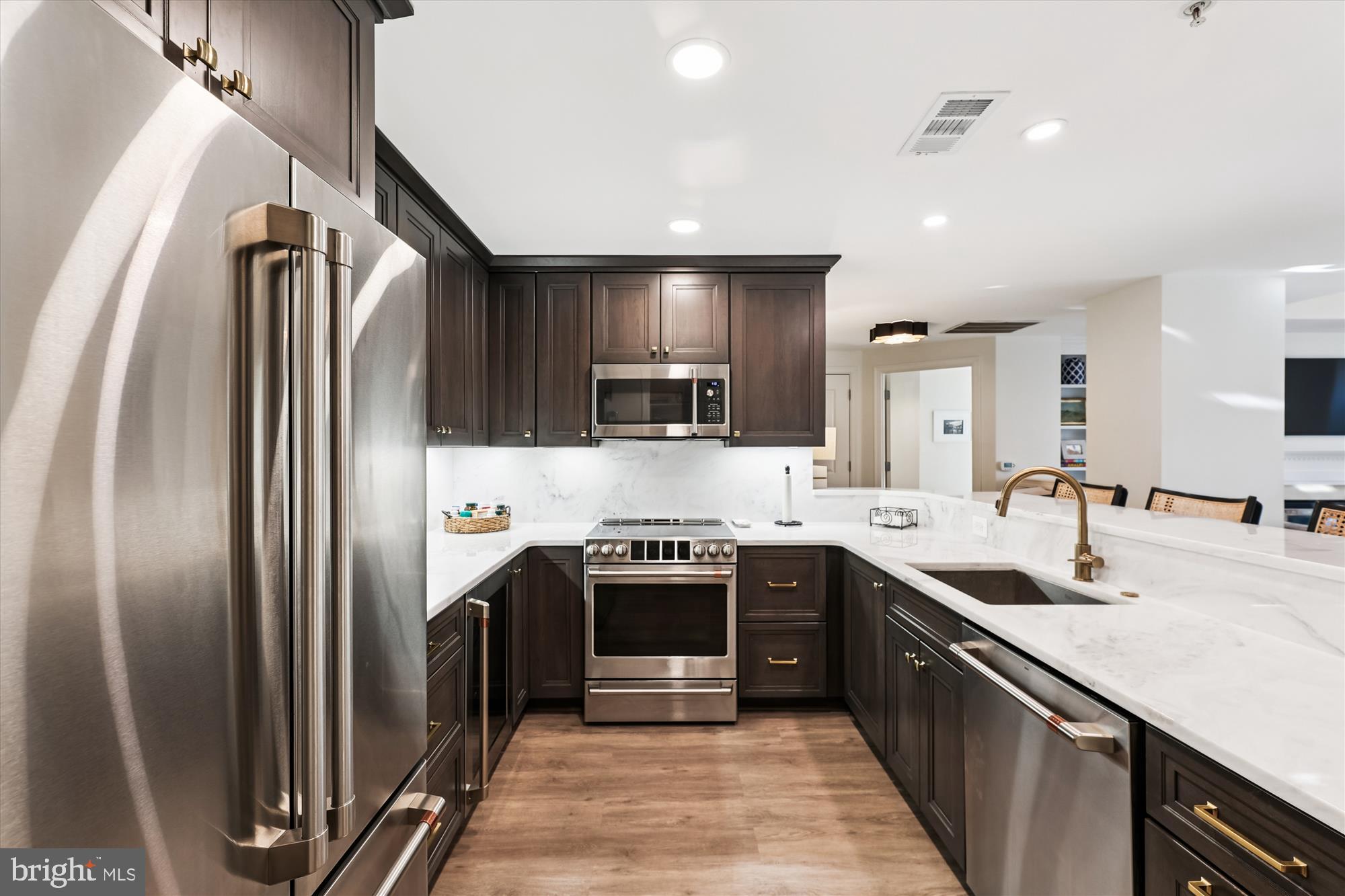 2501 Wisconsin Avenue Northwest, Unit 7 Washington, DC 20007 - Photo 9 of 30 a kitchen with stainless steel appliances granite countertop a sink stove and refrigerator