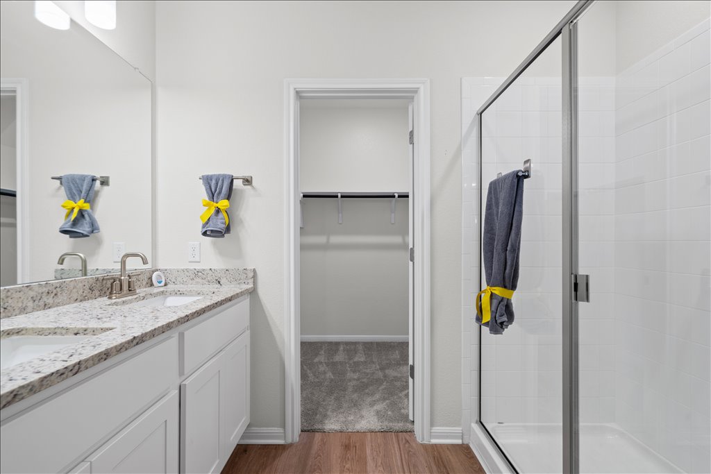 158 Gullivers Drive Elgin, TX 78621 - Photo 19 of 36 Check out this huge walk-in shower with its modern glass door and clean, bright white tile surround.