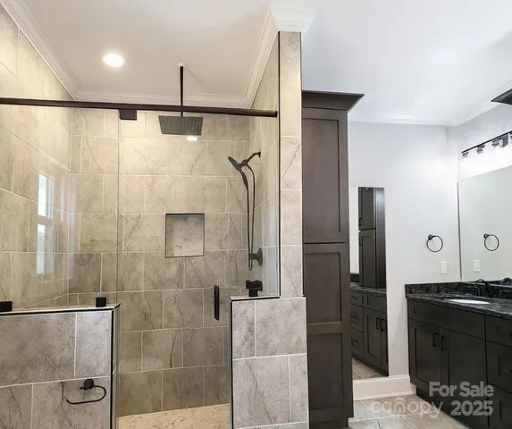 a bathroom with a shower and a sink