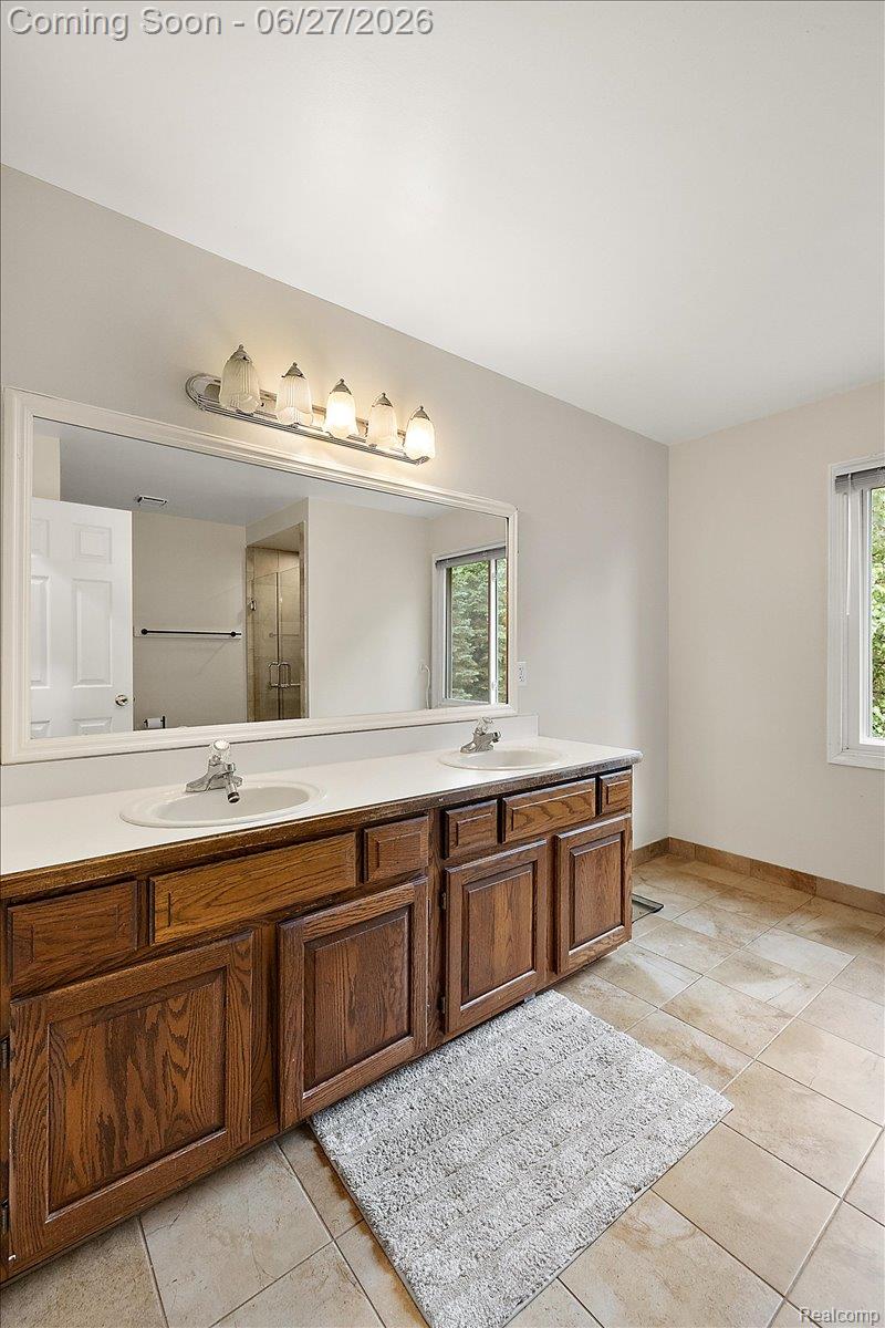 4193 Oak Tree Circle Rochester, MI 48306 - Photo 36 of 72 Primary Bathroom complete with his and her sinks and a large walk-in shower