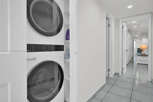 a view of a hallway with washer and dryer