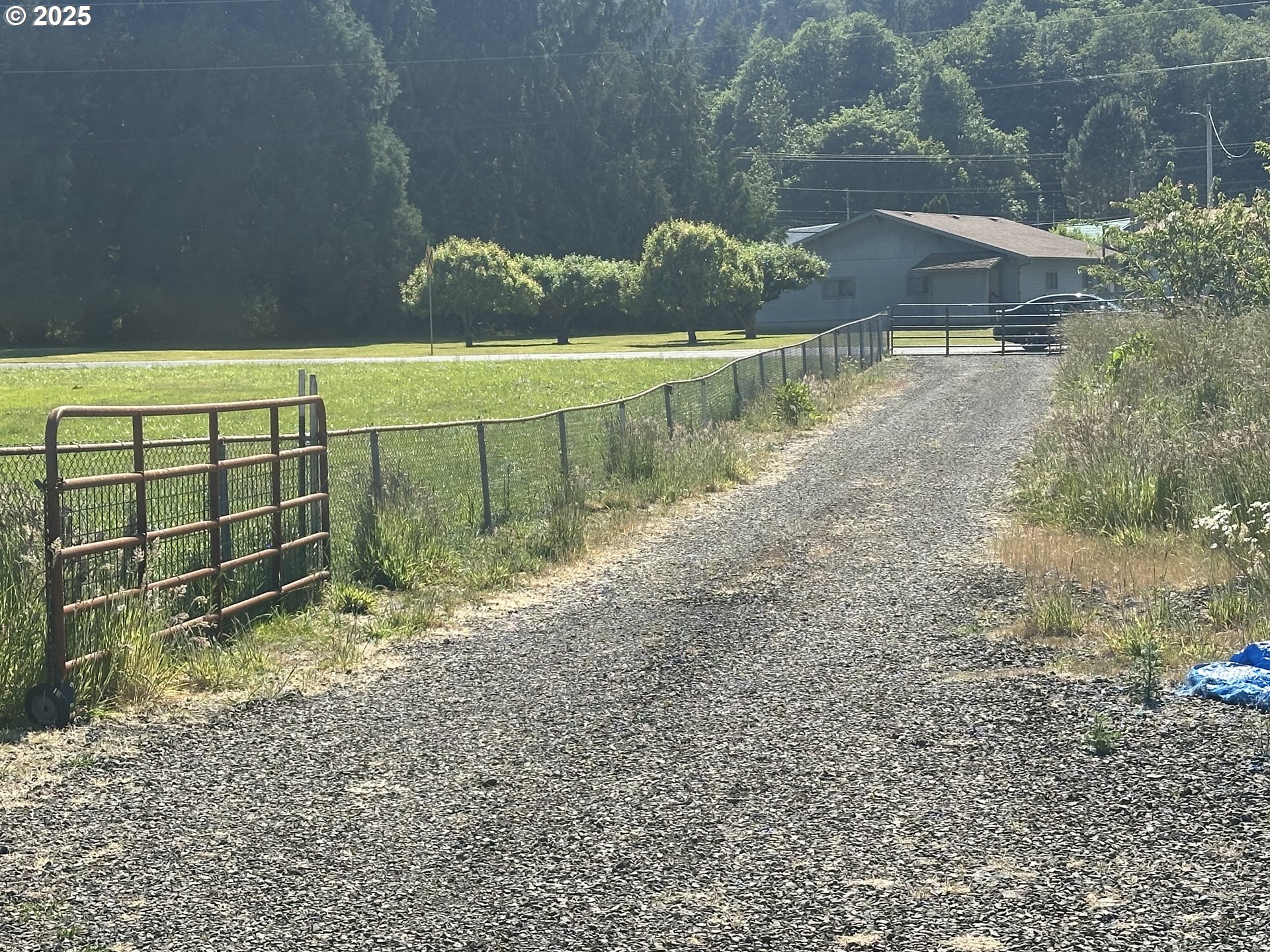 91171 Old Mill Town Road Clatskanie, OR 97016 - Photo 8 of 9 a view of a yard with wooden fence