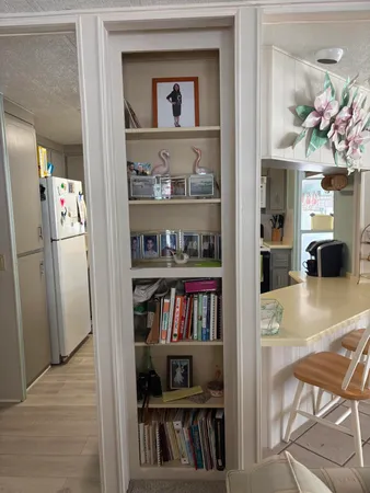 a view of a livingroom with furniture and cabinet