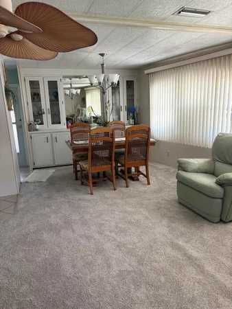 a view of a livingroom with furniture and window