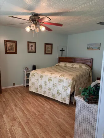 a bedroom with a bed and a dresser