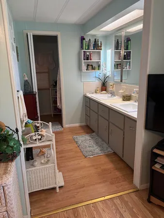 a kitchen with sink and refrigerator